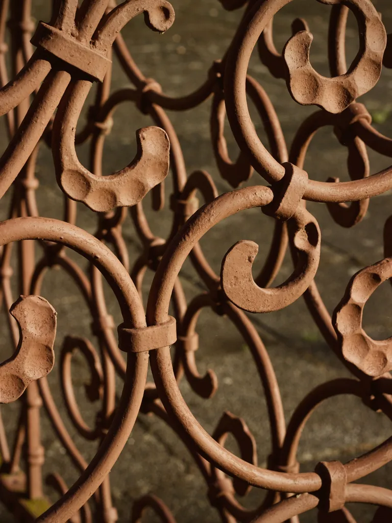 Hand-bent copper-toned wrought iron scrollwork